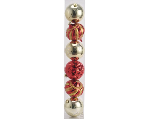 Verschieden geformte Christbaumkugeln in einer transparenten Röhre