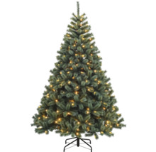 Geschmückter künstlicher Weihnachtsbaum mit Ständer
