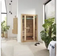 Infrarotsauna aus Holz in hellem Raum mit Pflanzen
