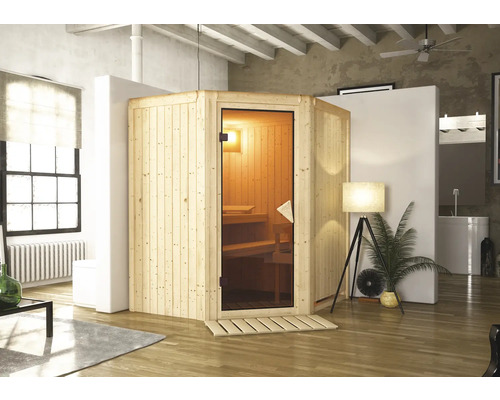Plug & Play Sauna Karibu Monja inkl. 3,6 kW Ofen u.integr.Steuerung ohne Dachkranz mit bronzierter Ganzglastüre Holz Sauna in einem hellen Raum