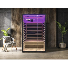 Innenansicht einer Infrarotsauna mit Glasfront und Holzverkleidung, beleuchtet mit violettem Licht.