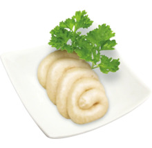 Weißwurst auf einem Teller mit Petersilie