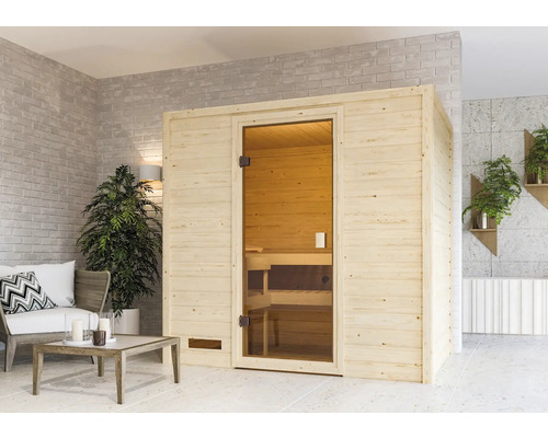 Plug & Play Sauna Karibu Selena inkl.3,6 kW Ofen u.integr.Steuerung ohne Dachkranz mit bronzierter Ganzglastüre Holzsauna mit Glastür in einem hellen Raum
