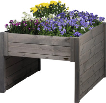 Hochbeet aus Holz mit bunten Blumen