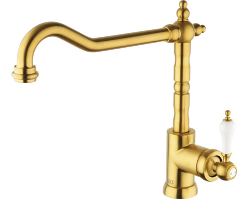 Goldfarbene Küchenarmatur mit klassischem Design und weißem Griff