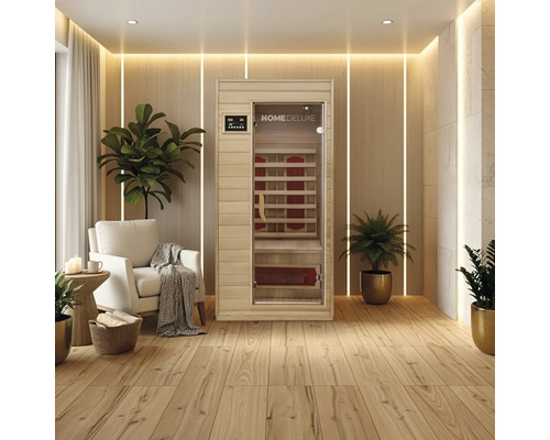 Infrarotkabine Home Deluxe Redsun S 90x90x190 cm Infrarotsauna in einem hellen, modernen Raum mit Holzboden und Pflanzen