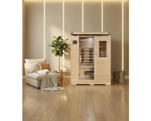 Infrarotsauna mit Sitzbank und Infrarotstrahlern in einem hellen Raum mit Holzboden