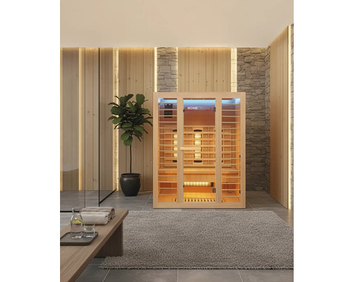 Innenraum mit Home Deluxe Infrarotsauna, Pflanze und Handtüchern