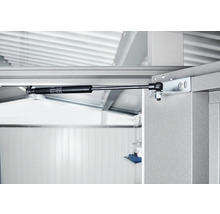 Detailaufnahme eines Gasdruckdämpfers an einem Metallrahmen.