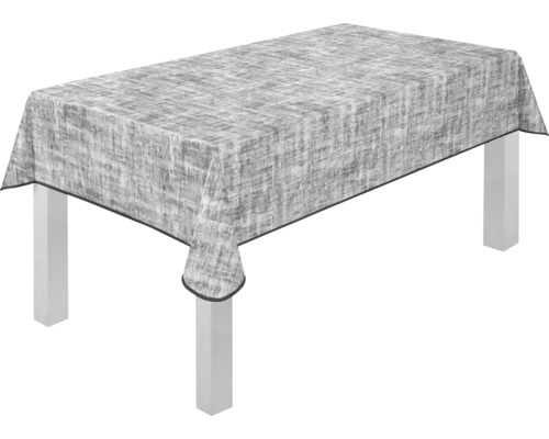 Tisch mit grau gemusterter Tischdecke