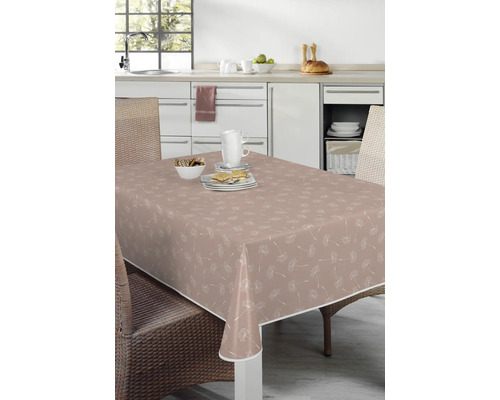 Tisch mit beschichteter Tischdecke mit Löwenzahnmuster in einer Küche