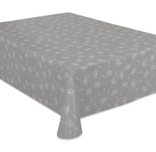 Graue Tischdecke mit Pusteblumenmuster auf einem Tisch.