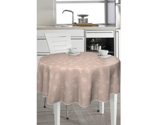 Runder Tisch mit Tischdecke mit Pflanzenmuster in einer Küche