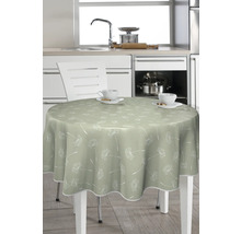 Runder Tisch mit Tischdecke und Tassen in einer Küche