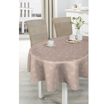 Ovaler Tisch mit Tischdecke mit Pusteblumenmuster, gedeckt mit Geschirr und Gebäck.