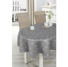 Grauer Tisch mit Pusteblumenmuster, gedeckt mit Geschirr