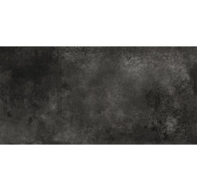 Dunkle Keramikfliese mit gesprenkelter Oberfläche.