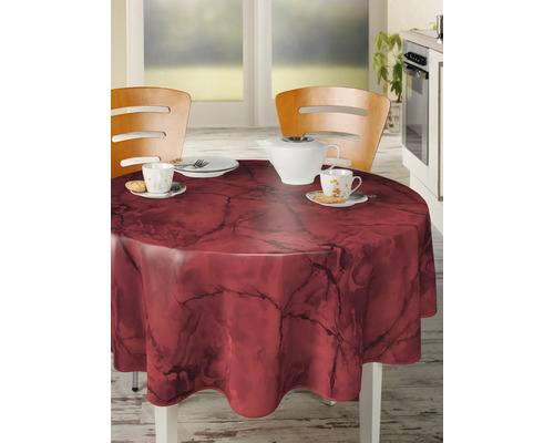 Runder Tisch mit dunkelroter Marmor Tischdecke in einer Küche