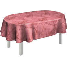 Ovaler Tisch mit gemusterter Tischdecke