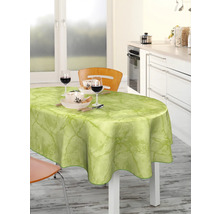 Esstisch mit hellgrüner Wachstuchdecke und Geschirr in einer hellen Küche.