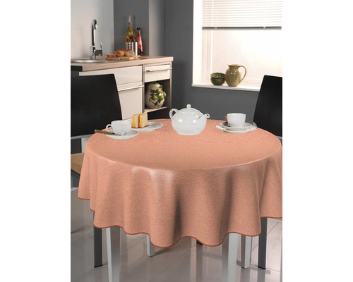 Tischszene mit runder Tischdecke, Teekanne und Geschirr