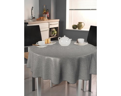 Graue Tischdecke auf einem runden Tisch in einer Küche