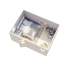 Innenansicht eines Gartenhauses mit Bett, Tisch und Stühlen