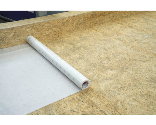 Rolle weiße Unterlagsbahn auf Holzuntergrund