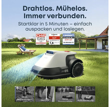 Eufy Mähroboter E15 im Einsatz auf einer Rasenfläche mit Person im Hintergrund