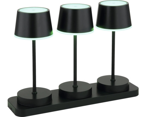 Drei schwarze Tischleuchten auf einer Ladestation für den Innenbereich