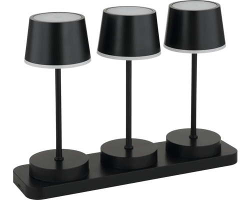 Drei schwarze Tischleuchten auf einer Halterung