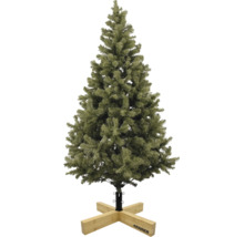 Künstlicher Christbaum mit grünen Nadeln auf einem hölzernen Christbaumständer von Krinner.