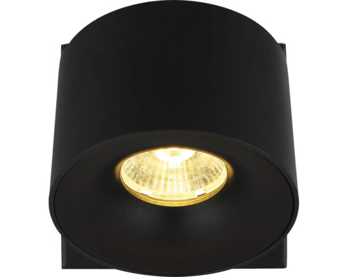 Schwarze zylindrische Außenwandleuchte mit warmem Licht.