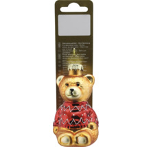 Christbaumschmuck aus Glas in Form eines Teddybären mit rotem Pullover und Aufhänger auf einer Verkaufsverpackung.