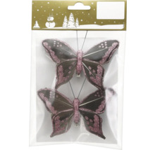 Zwei dekorative Schmetterlings-Clips mit rosa Glitzer und dunklen Federn in der Verkaufsverpackung mit Geroma Logo.