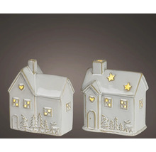 Zwei dekorative Keramikhäuschen mit LED-Beleuchtung, winterlichen Reliefmotiven und Aussparungen in Herz- und Sternform.