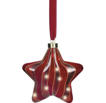 Sternförmiger Christbaumschmuck aus Glas mit roten und goldfarbenen Wellenstreifen, an einem roten Samtband hängend.