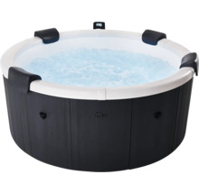 Rundes Whirlpool mit dunkler Außenverkleidung in Holzoptik, weißem Innenbecken, vier schwarzen Kopfstützen und sprudelndem Wasser. MSpa Logo.