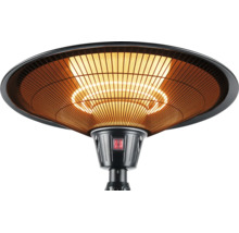 Elektrischer Terrassenstrahler in Schwarz mit Schutzgitter und leuchtendem Heizelement.