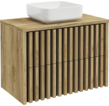 Waschtischunterschrank in Holzoptik mit Lamellen-Front und weißem Aufsatzwaschbecken.