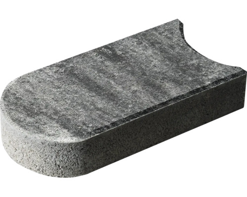 Rechteckiger Pflasterstein aus Beton mit einer abgerundeten und einer konkaven Seite.