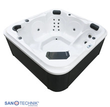 Quadratischer Außenwhirlpool mit weißer Innenwanne, dunkler Außenverkleidung, Massagedüsen und Kopfstützen.