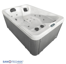 Sanotechnik Whirlpool mit weißer Wanne, grauer Außenverkleidung in Holzoptik und integrierten Massagedüsen.