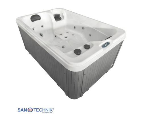 Sanotechnik Whirlpool mit weißer Wanne, grauer Außenverkleidung in Holzoptik und integrierten Massagedüsen.