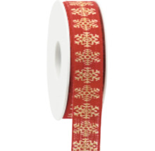Weihnachtliches Geschenkband mit Schneeflocken-Muster auf einer Rolle