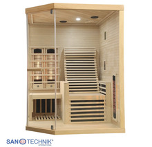 Infrarotkabine aus hellem Holz mit Glasfront, ergonomischer Liege und integrierten Heizelementen.