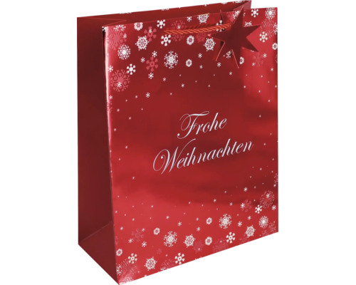 Rote Geschenktüte mit weißem Schriftzug Frohe Weihnachten, Schneeflockenmotiven und einer Tragekordel.