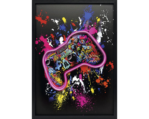 Gerahmtes Wandbild mit Gaming-Controller im Graffiti-Stil und bunten Farbspritzern auf schwarzem Grund.