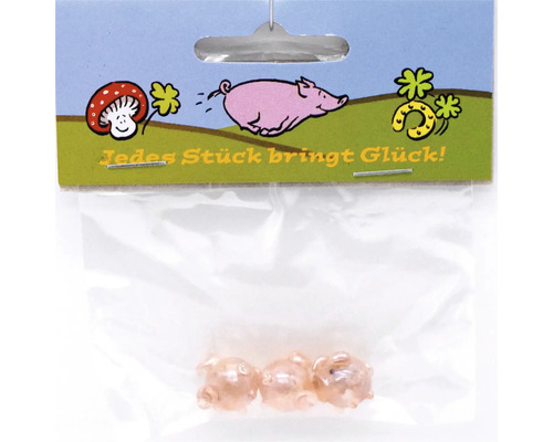 Drei kleine Glücksschweinchen Figuren in einer Kunststoffverpackung mit der Aufschrift Jedes Stück bringt Glück