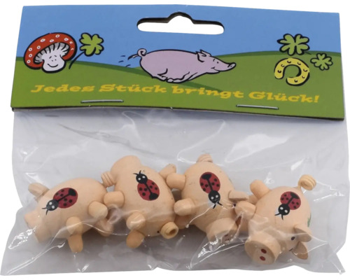 Vier kleine Holzschweinchen mit Marienkäfermotiv in transparenter Kunststoffverpackung mit Glücksbringeraufdruck.